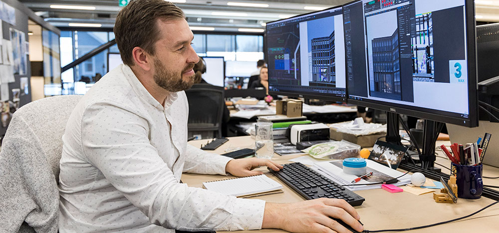 Man using computer in office.